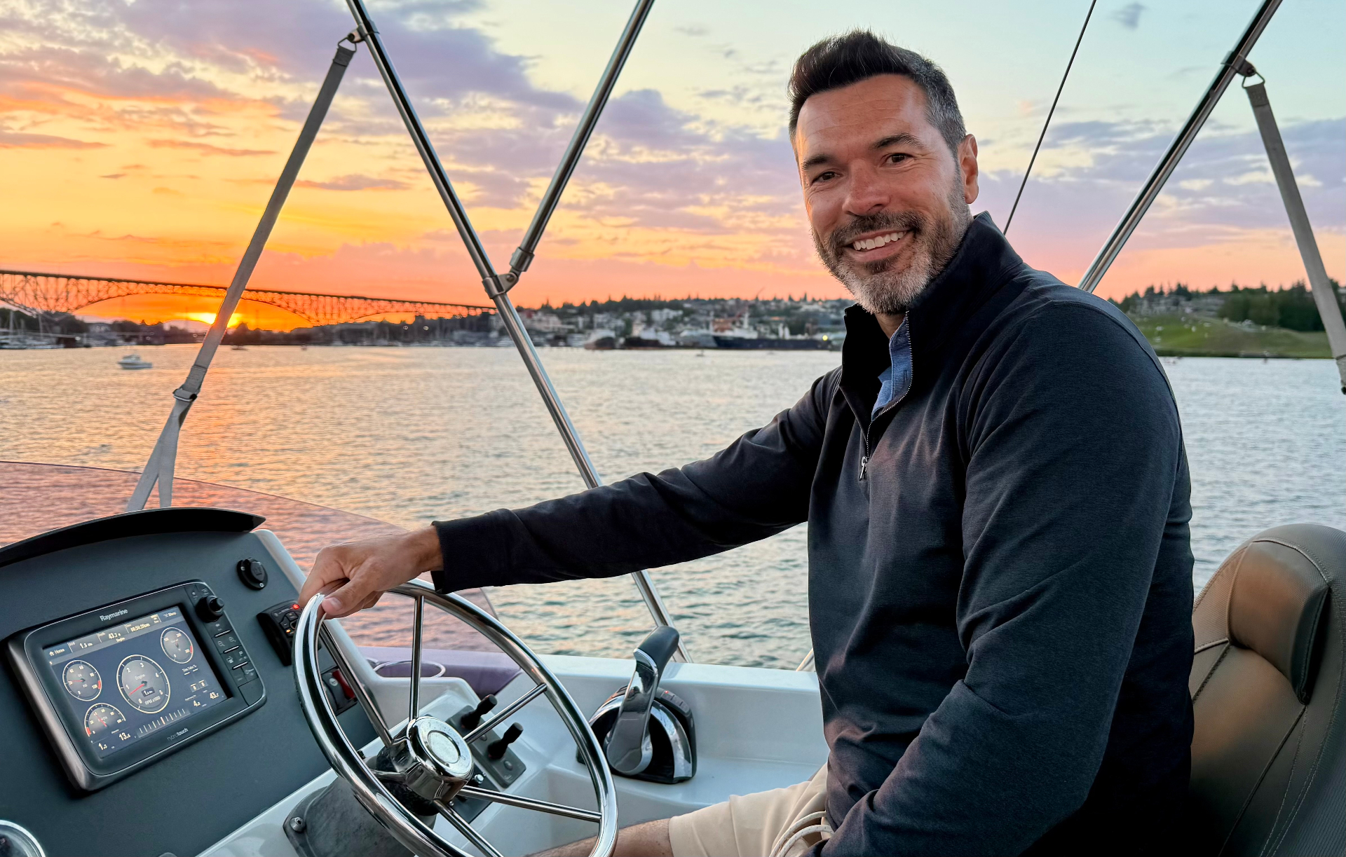 Captain Jeff at the helm at sunset on Lake Union