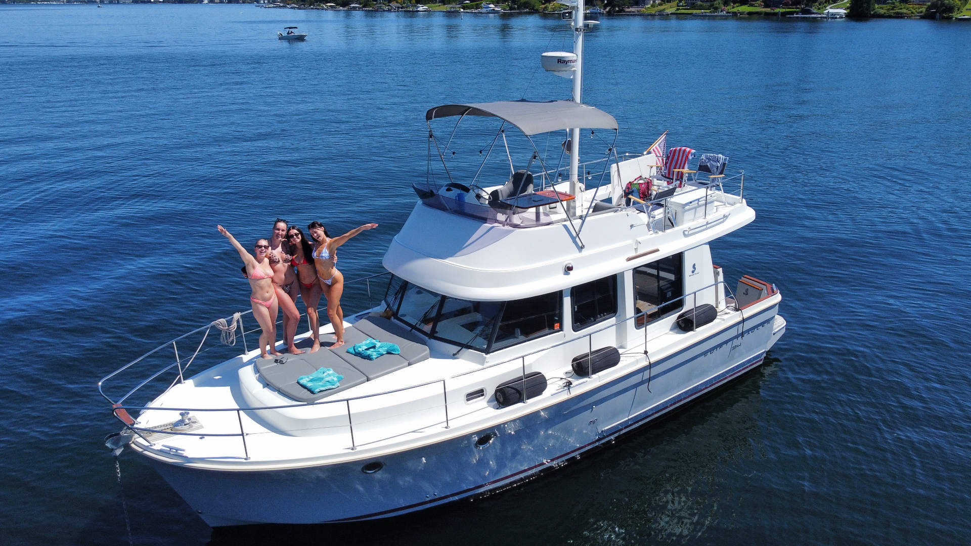 Private charter yacht on Lake Union with the Seattle skyline at golden hour