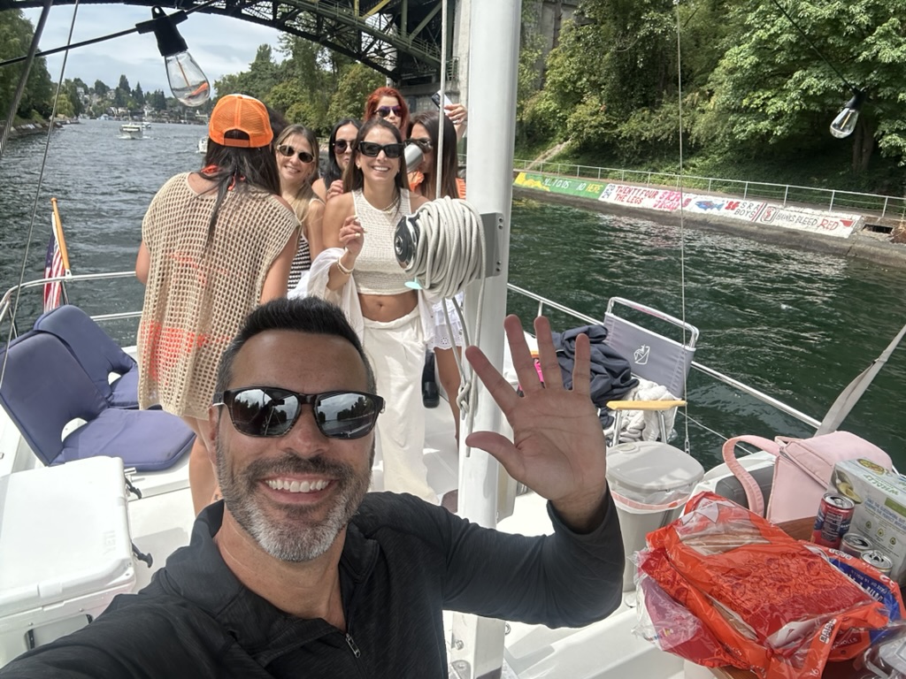 Captain Jeff with guests cruising under the Aurora Bridge